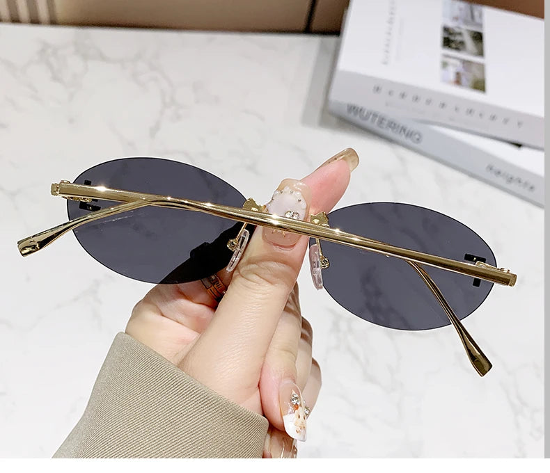 Protective Glasses Fashion Oval Rimless Design Sunglasses Female Small Size Metal Suneyeglass Outdoors Casual Vacation UV400
